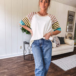 Stripe Mix Cotton Half Sleeve Top. Vibrant striping down the sleeves, exposed seams and a contrasting front and back color blocking, oversized fit and athleisure vibe.
