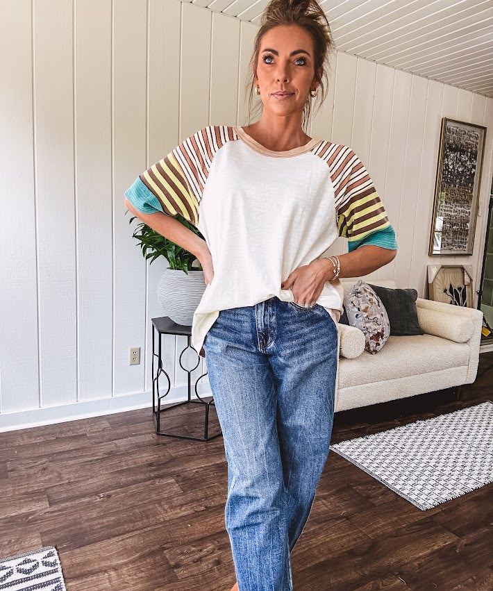 Stripe Mix Cotton Half Sleeve Top. Vibrant striping down the sleeves, exposed seams and a contrasting front and back color blocking, oversized fit and athleisure vibe.