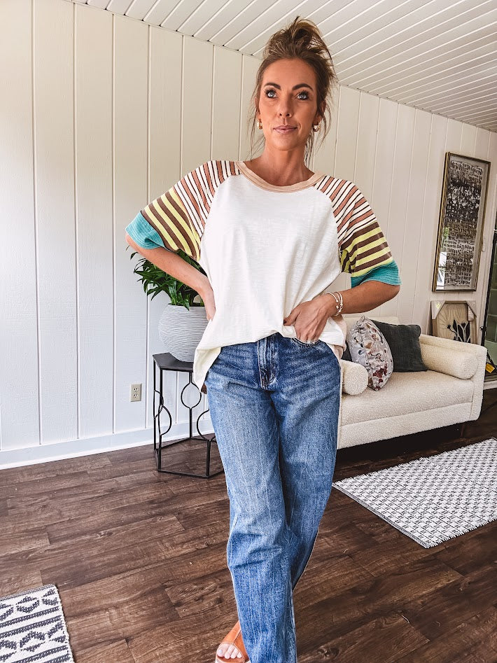 Stripe Mix Cotton Half Sleeve Top. Vibrant striping down the sleeves, exposed seams and a contrasting front and back color blocking, oversized fit and athleisure vibe.