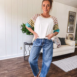 Stripe Mix Cotton Half Sleeve Top. Vibrant striping down the sleeves, exposed seams and a contrasting front and back color blocking, oversized fit and athleisure vibe.