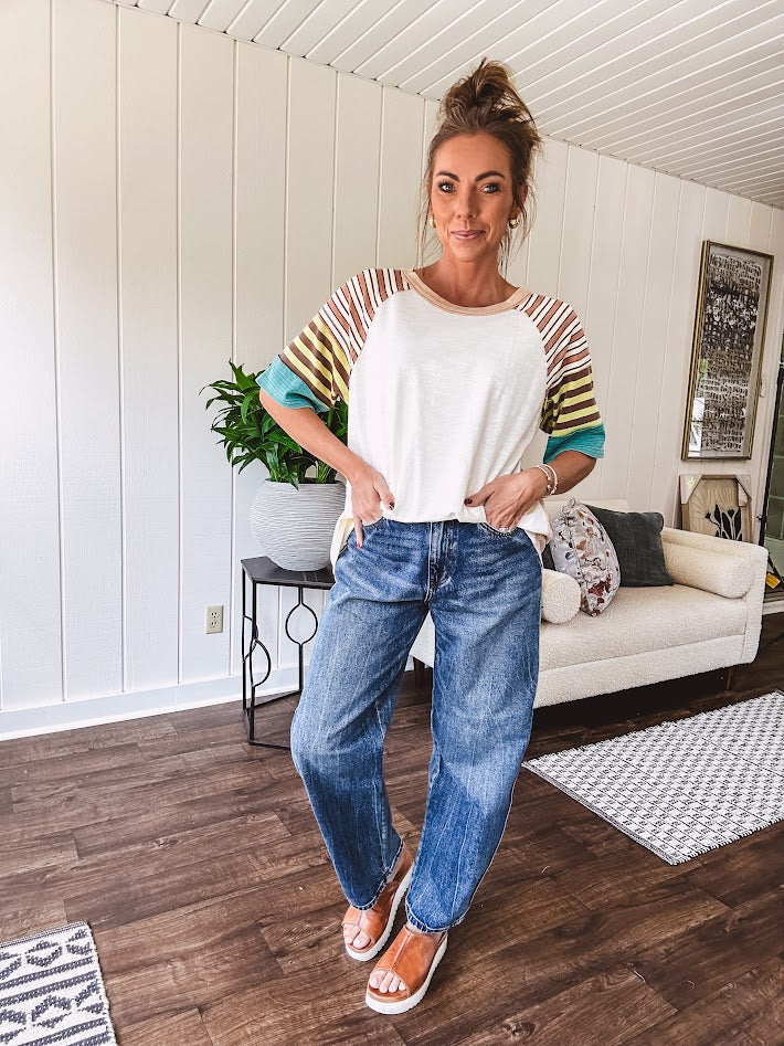 Stripe Mix Cotton Half Sleeve Top. Vibrant striping down the sleeves, exposed seams and a contrasting front and back color blocking, oversized fit and athleisure vibe.