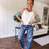 Stripe Mix Cotton Half Sleeve Top. Vibrant striping down the sleeves, exposed seams and a contrasting front and back color blocking, oversized fit and athleisure vibe.