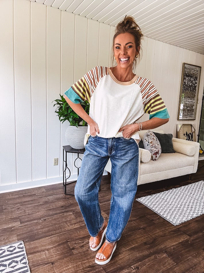Stripe Mix Cotton Half Sleeve Top. Vibrant striping down the sleeves, exposed seams and a contrasting front and back color blocking, oversized fit and athleisure vibe.