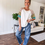 Stripe Mix Cotton Half Sleeve Top. Vibrant striping down the sleeves, exposed seams and a contrasting front and back color blocking, oversized fit and athleisure vibe.