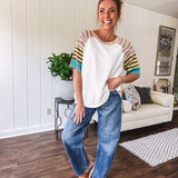 Stripe Mix Cotton Half Sleeve Top. Vibrant striping down the sleeves, exposed seams and a contrasting front and back color blocking, oversized fit and athleisure vibe.