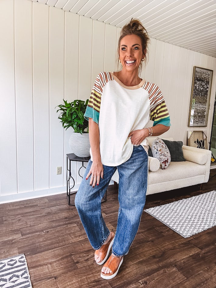 Stripe Mix Cotton Half Sleeve Top. Vibrant striping down the sleeves, exposed seams and a contrasting front and back color blocking, oversized fit and athleisure vibe.