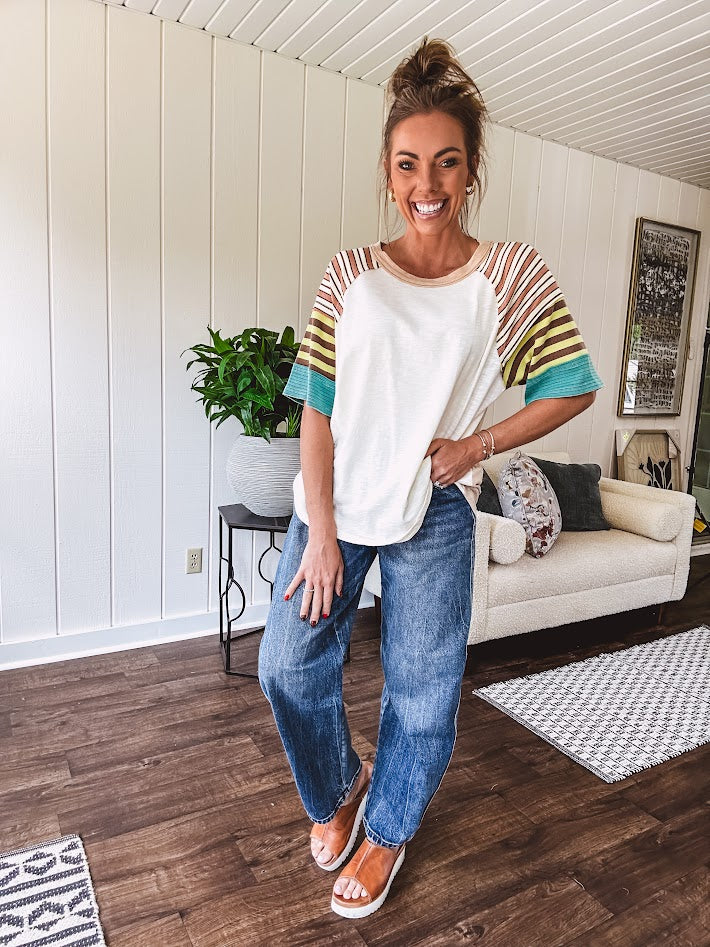 Stripe Mix Cotton Half Sleeve Top. Vibrant striping down the sleeves, exposed seams and a contrasting front and back color blocking, oversized fit and athleisure vibe.
