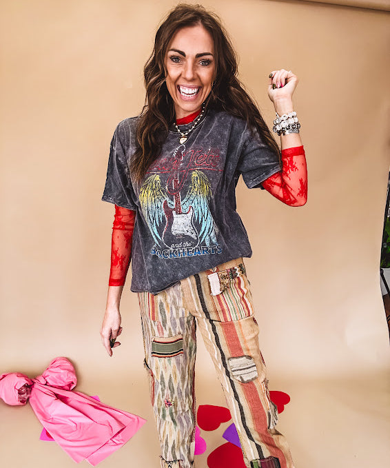 Cotton straight leg ethnic print pants in muted magenta, cream, red, blue and mustard.