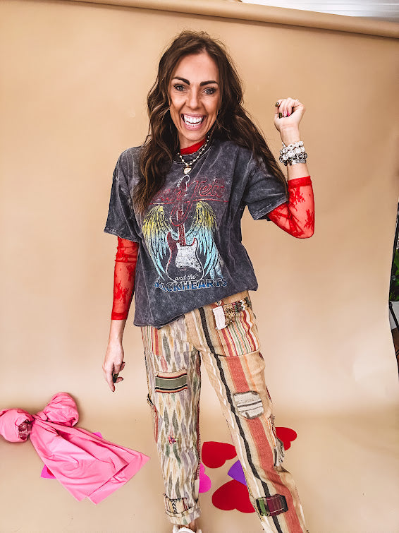 Cotton straight leg ethnic print pants in muted magenta, cream, red, blue and mustard.