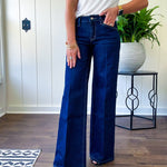 Soft comfort-stretch denim with an easy, flexible fit
Flattering mid-rise waist
Classic five-pocket design
Full-length wide-leg silhouette
Features a trouser-inspired front fold crease detail
Finished hem for a polished look
Dark wash denim