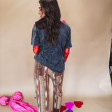 Cotton straight leg ethnic print pants in muted magenta, cream, red, blue and mustard.