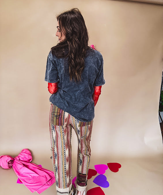 Cotton straight leg ethnic print pants in muted magenta, cream, red, blue and mustard.