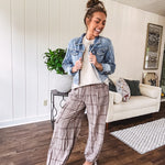 Cotton light mocha plaid mineral wash pants with elastic waist, cargo pockets and drawstring hem.