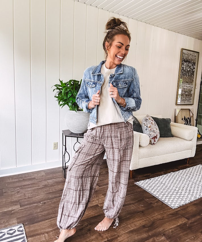 Cotton light mocha plaid mineral wash pants with elastic waist, cargo pockets and drawstring hem.