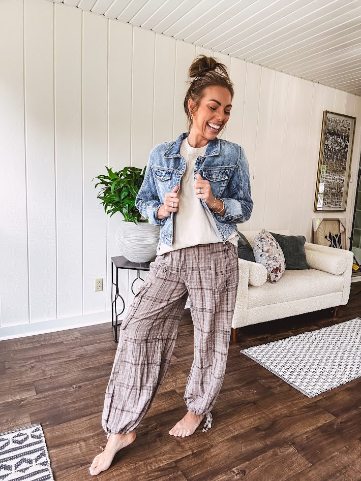 Cotton light mocha plaid mineral wash pants with elastic waist, cargo pockets and drawstring hem.
