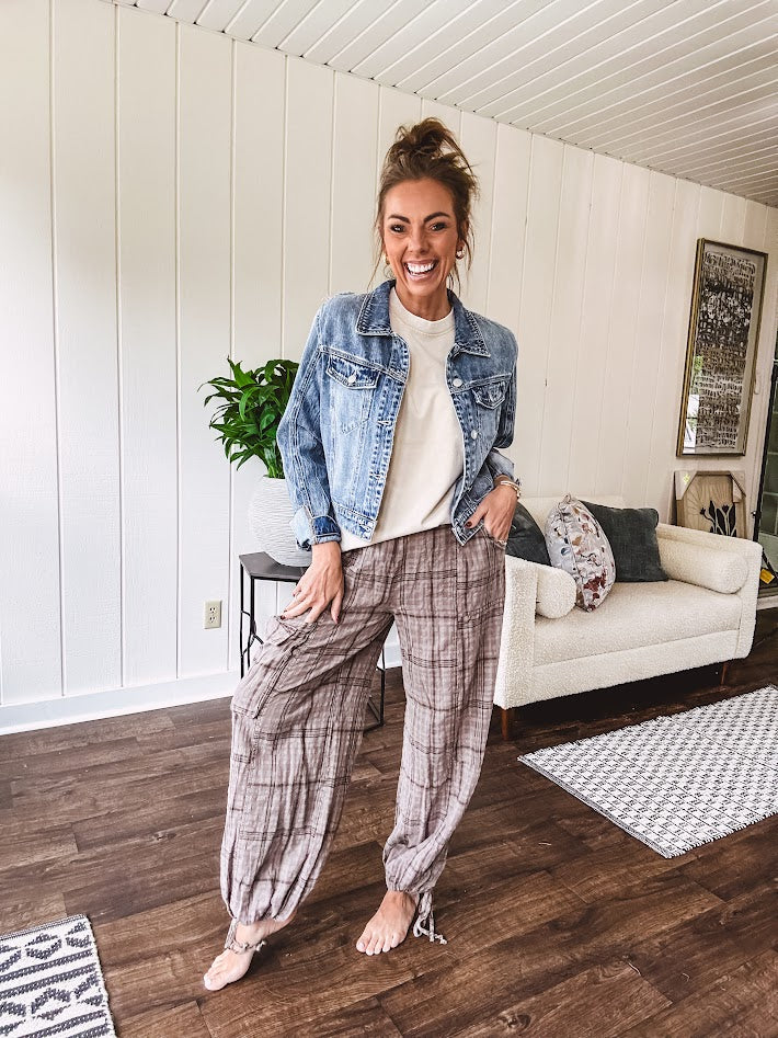 Cotton light mocha plaid mineral wash pants with elastic waist, cargo pockets and drawstring hem.