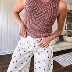 Washed cable knit sweater tank with shorter hem.