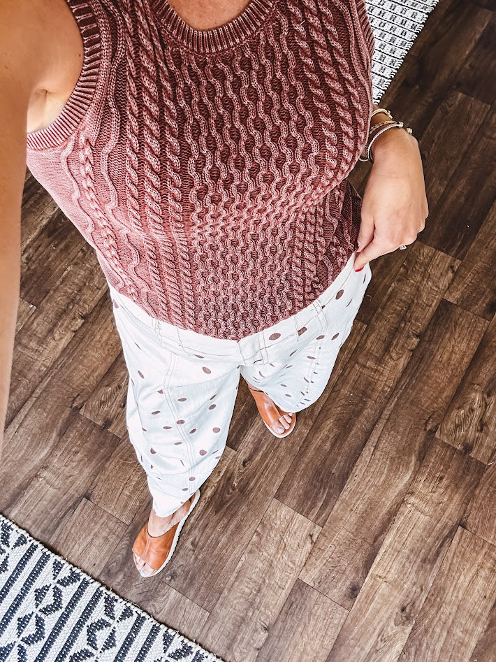 Washed cable knit sweater tank with shorter hem.