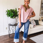 Soft, terry-like mauve top with cap sleeves, collar and split hem with contrasting olive at collar, three button front and cuffs.