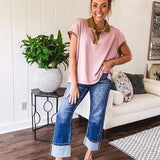 Soft, terry-like mauve top with cap sleeves, collar and split hem with contrasting olive at collar, three button front and cuffs.