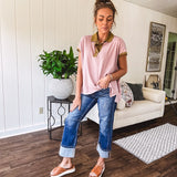 Soft, terry-like mauve top with cap sleeves, collar and split hem with contrasting olive at collar, three button front and cuffs.