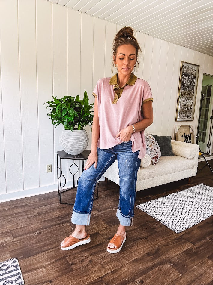 Soft, terry-like mauve top with cap sleeves, collar and split hem with contrasting olive at collar, three button front and cuffs.