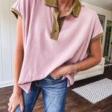 Soft, terry-like mauve top with cap sleeves, collar and split hem with contrasting olive at collar, three button front and cuffs.