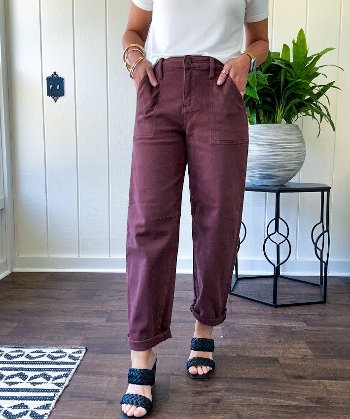 Brown barrel denim with high rise and cuffed hem at the ankle.