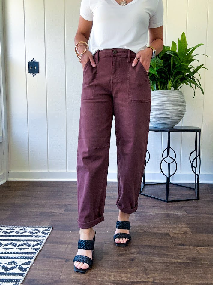 Brown barrel denim with high rise and cuffed hem at the ankle.