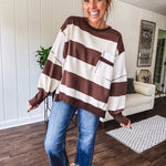 Oversized terry knit long sleeved pullover in brown and ivory large stripes, oversized front pocket, wide hem and cuffs and split hem.