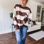 Oversized terry knit long sleeved pullover in brown and ivory large stripes, oversized front pocket, wide hem and cuffs and split hem.