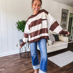Oversized terry knit long sleeved pullover in brown and ivory large stripes, oversized front pocket, wide hem and cuffs and split hem.