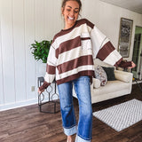 Oversized terry knit long sleeved pullover in brown and ivory large stripes, oversized front pocket, wide hem and cuffs and split hem.