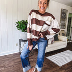 Oversized terry knit long sleeved pullover in brown and ivory large stripes, oversized front pocket, wide hem and cuffs and split hem.