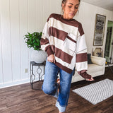 Oversized terry knit long sleeved pullover in brown and ivory large stripes, oversized front pocket, wide hem and cuffs and split hem.