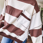 Oversized terry knit long sleeved pullover in brown and ivory large stripes, oversized front pocket, wide hem and cuffs and split hem.