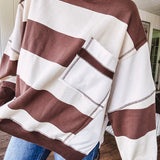 Oversized terry knit long sleeved pullover in brown and ivory large stripes, oversized front pocket, wide hem and cuffs and split hem.