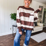Oversized terry knit long sleeved pullover in brown and ivory large stripes, oversized front pocket, wide hem and cuffs and split hem.