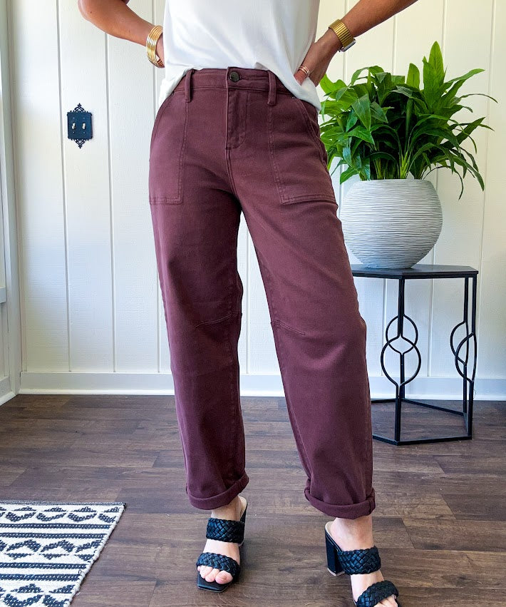Brown barrel denim with high rise and cuffed hem at the ankle.