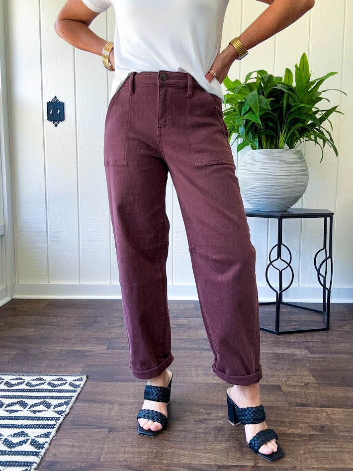 Brown barrel denim with high rise and cuffed hem at the ankle.