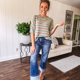 Lightweight, striped drop shoulder sweater tee in a soft sage or rust base  with warm stripes of light brown, taupe, and spice, and ribbed detailing at the neck, cuffs, and hem.