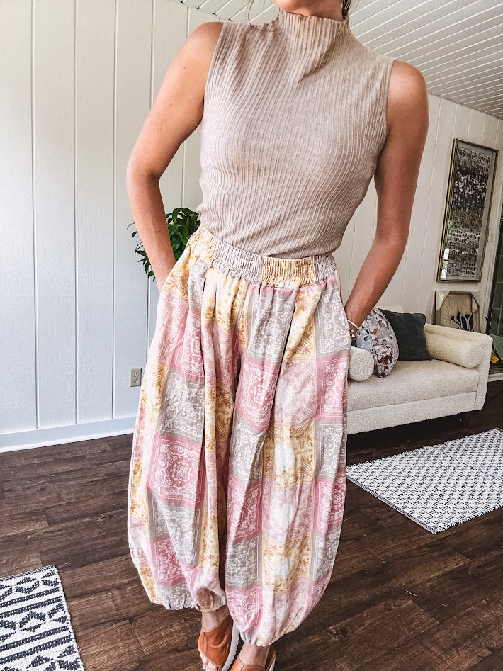 Soft, ribbed mock neck sleeveless top.