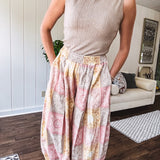 Lightweight cotton balloon style pants with elastic waist and cuffs, side pockets and pastel taupe, pink and coral paisley bandana print.