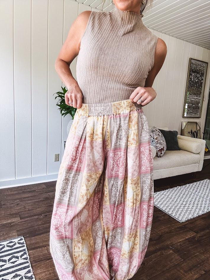 Soft, ribbed mock neck sleeveless top.