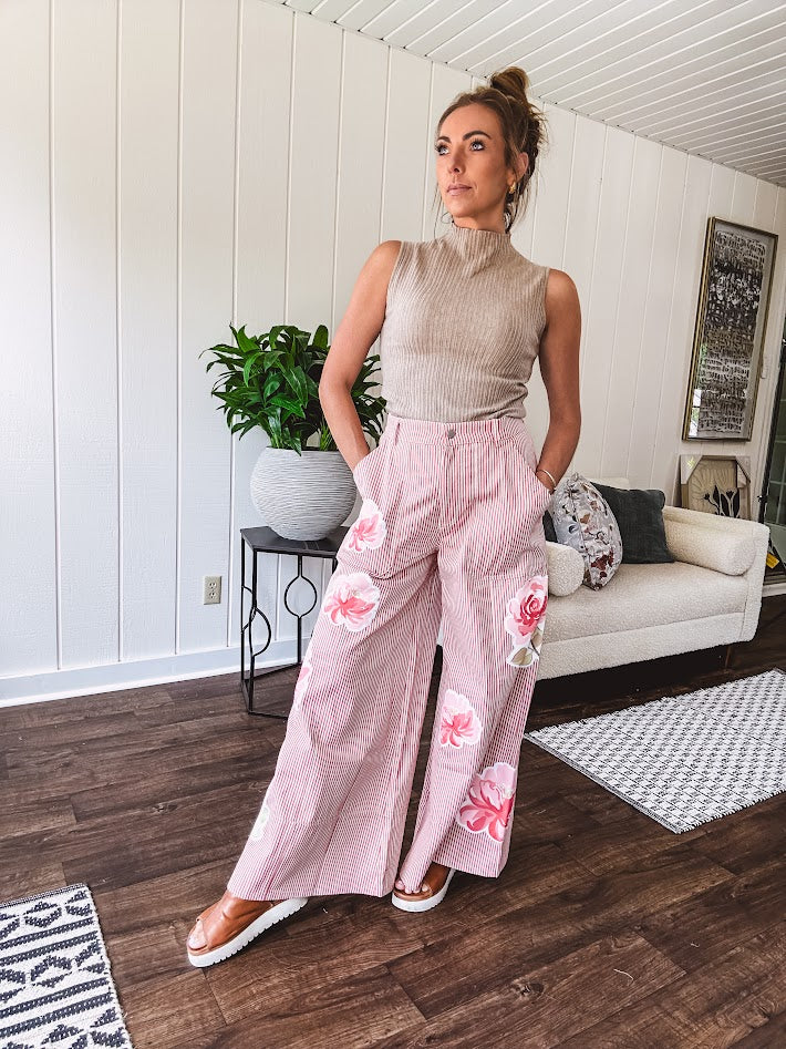 Soft, ribbed mock neck sleeveless top.