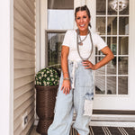 light wash denim joggers with crochet patchwork and drawstring waist