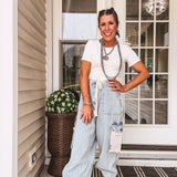 light wash denim joggers with crochet patchwork and drawstring waist