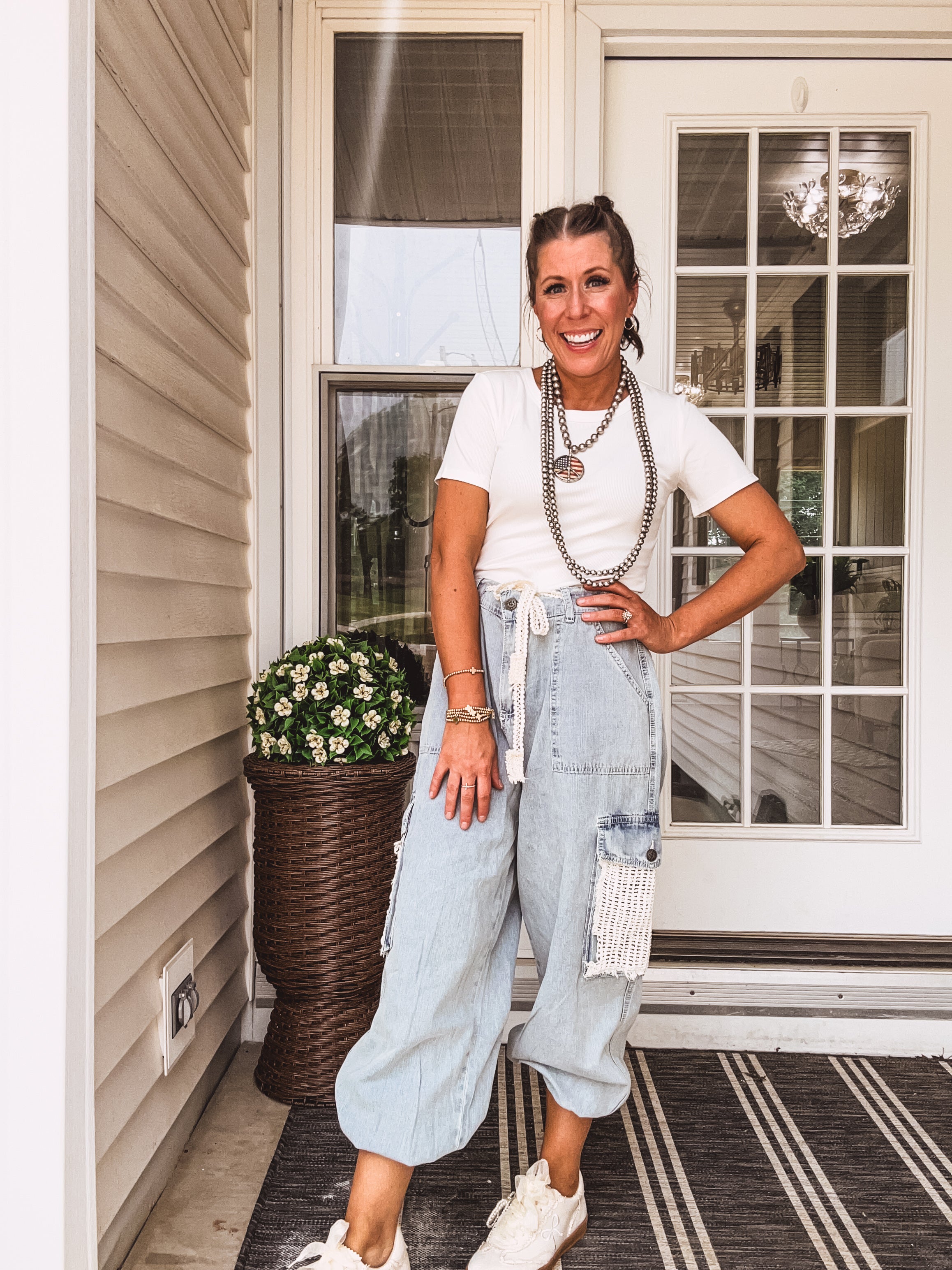 light wash denim joggers with crochet patchwork and drawstring waist