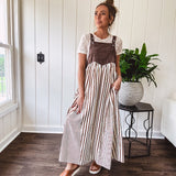 Short sleeved ivory sheer mesh with ribbon bows embroidered throughout and round neck design.