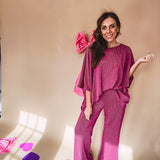 Plum ribbed textured travel set with oversized top with 3/4 sleeves and matching pants with drawstring waist and wide leg.